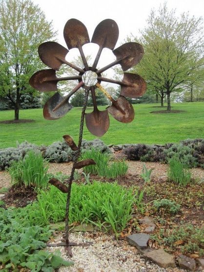 large garden art made from spade shovels