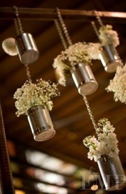Tin cans and baby’s breath. Cute!