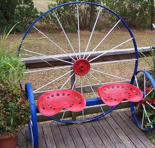 Steel wagon wheel garden bench!  Love this and I have two tractor seats.
