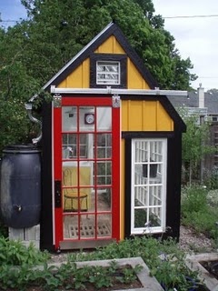 amazingly cute greenhouse. And check out the gutter & rain barrel on the side!