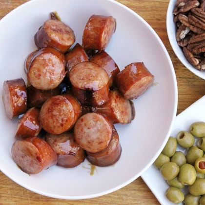 Kielbasa In Maple & Beer.      1 pound kielbasa, cut into 1″ chunks     1 cup beer, (any type)     1/2 cup maple syrup  Notes:  Serves 4-6 How to make it      Combine everything in a heavy pot and simmer until sauce thickens and kielbasa starts to brown (about 30 minutes).