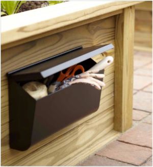 Store gardening tools in mailboxes on the side of your raised garden bed