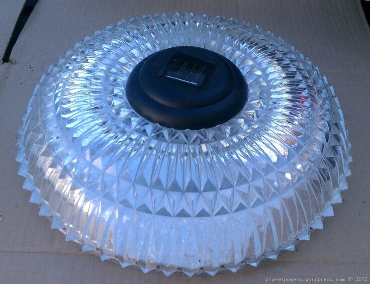 Repurpose light shades into solar lights for the garden.