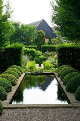 WOLLERTON OLD HALL GARDEN, SHROPSHIRE: THE RILL WITH BOX BALLS AND BOX BALLS AND YEW HEDGING