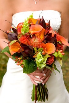Love this bouquet with the orange calla lillies