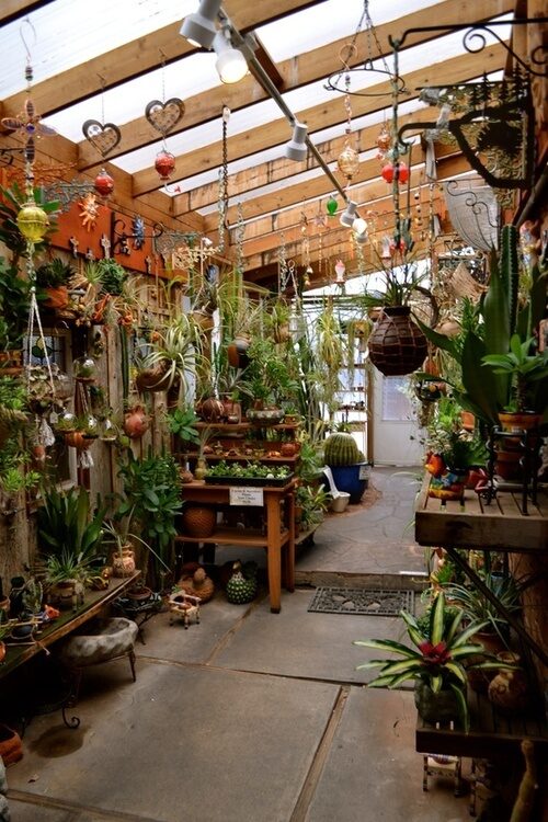 Someday the garage will look this good: grow lights?  And crafting on the other side…