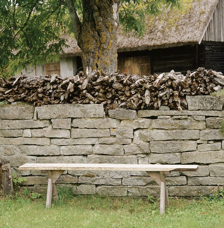 Kindling stacked on a stone wall