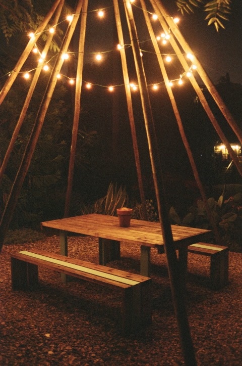 Garden lights over picnic table – this is so beautiful! Add netting and voila` you have a screened in picnic bench!