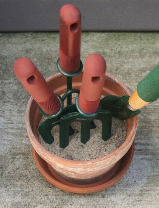 Creative Organizing — fill pots with sand, add oil to keep metal tools from rusting.