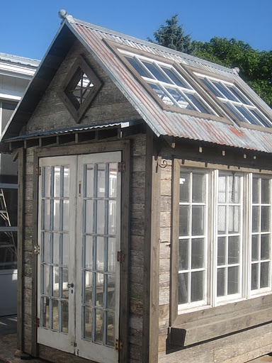 Old windows and wood pallets greenhouse