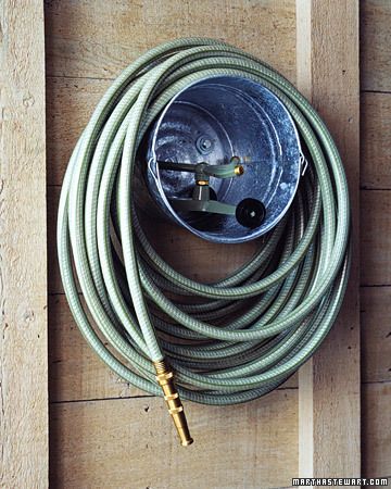 galvanized bucket to wrap hose around.. and you can store the sprinkler inside.