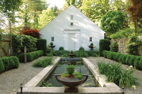 water feature, boxwood & urns