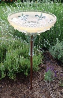 This is one of the vintage glass light shades I repurposed into a bird