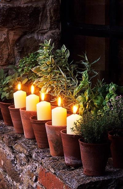 Candles in garden flower pots-great idea