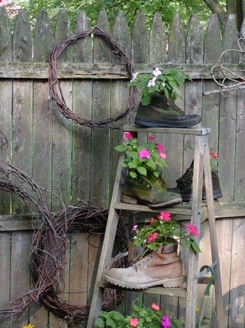 Old work boots laying around your basement or garage? Plant them with impatiens and perch them on an old ladder (that really shouldn’t be in use anyway!) tucked into a shady corner of your garden….cute :)