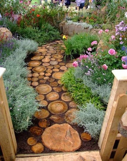 Reuse an old tree to make a log pathway in your garden.