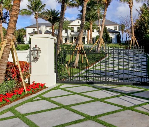 Create Awesome Patterns – This stunning combination is created with large concrete pavers with grass jointing.