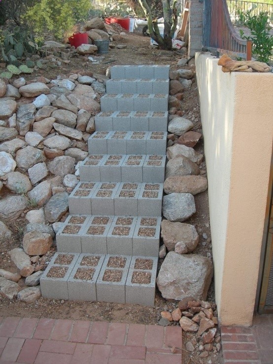 fill cinder blocks with a creeping ground cover like thyme which smells so good when walked on.