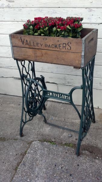 Old Sewing Machine Base…re-purposed into a primitive planter with the addition of an old wood crate!!