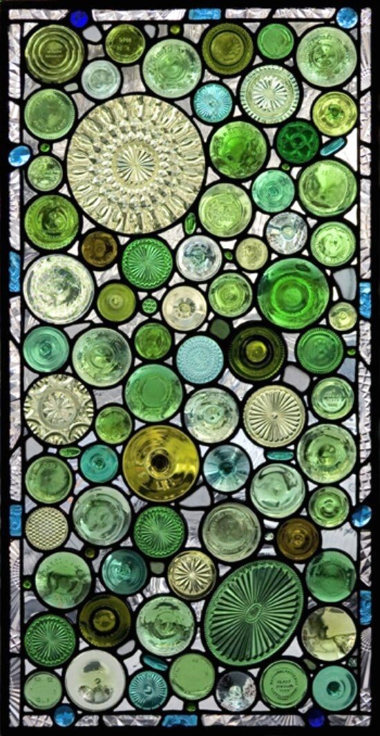 the bottoms of bottles and old glass serving dishes used to make windows. / or would make a great addition to a garden