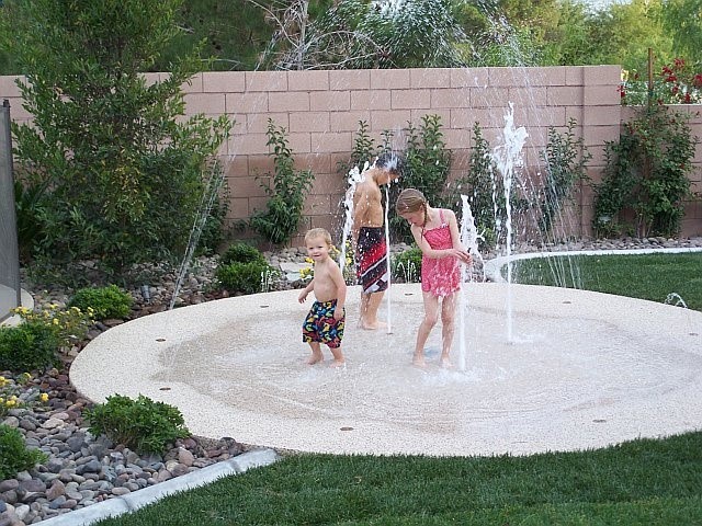 backyard splash pad! No up keep. Small footprint. Cheaper than a pool. Awesome. I love this idea!