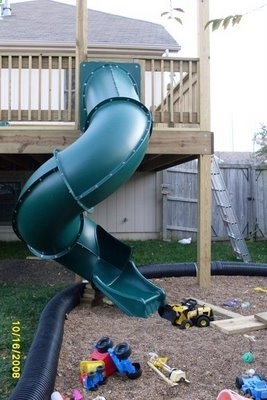 Love this idea of putting a slide off the deck for the kids!!! Think of how much fun theyd have ( how much energy theyd burn) sliding down and running back up. :)