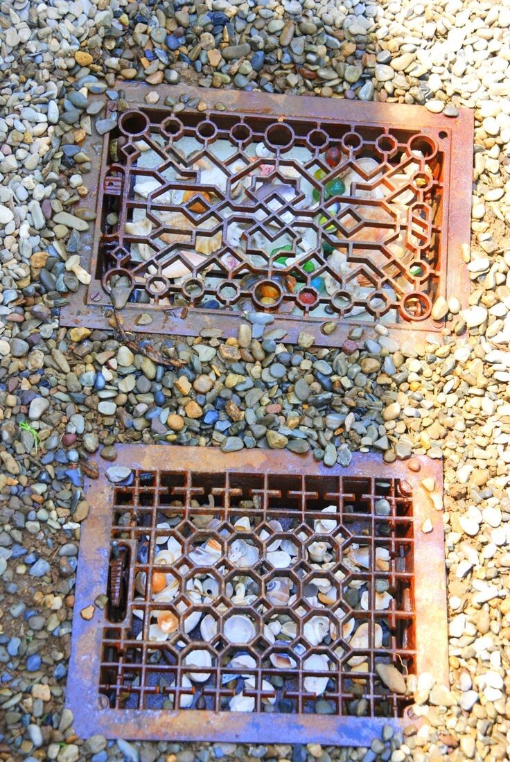 stepping stones made out of heater vents with marbles or sea glass underneath so beautiful