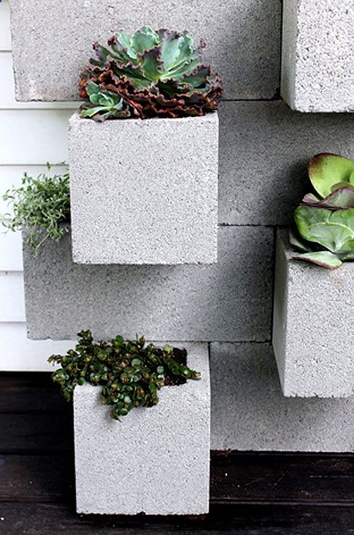 These Do-It-Yourself Cinder Block Planters are a great project for the garden on a budget.