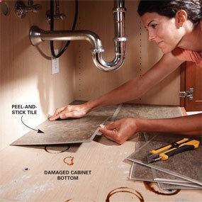 Peel and stick tiles under the sink. Looks clean and is easy to wipe the surface.