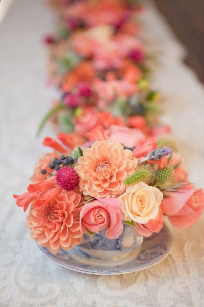 Mini bouquets in tea cups–I really like this idea. Just a touch of flowers.