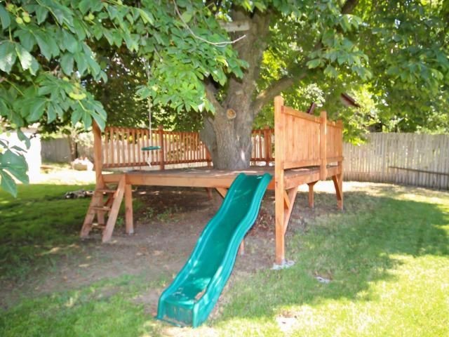 Kids Tree Deck. Cool take on a tree house. Could also attach to the play set with a rope bridge?