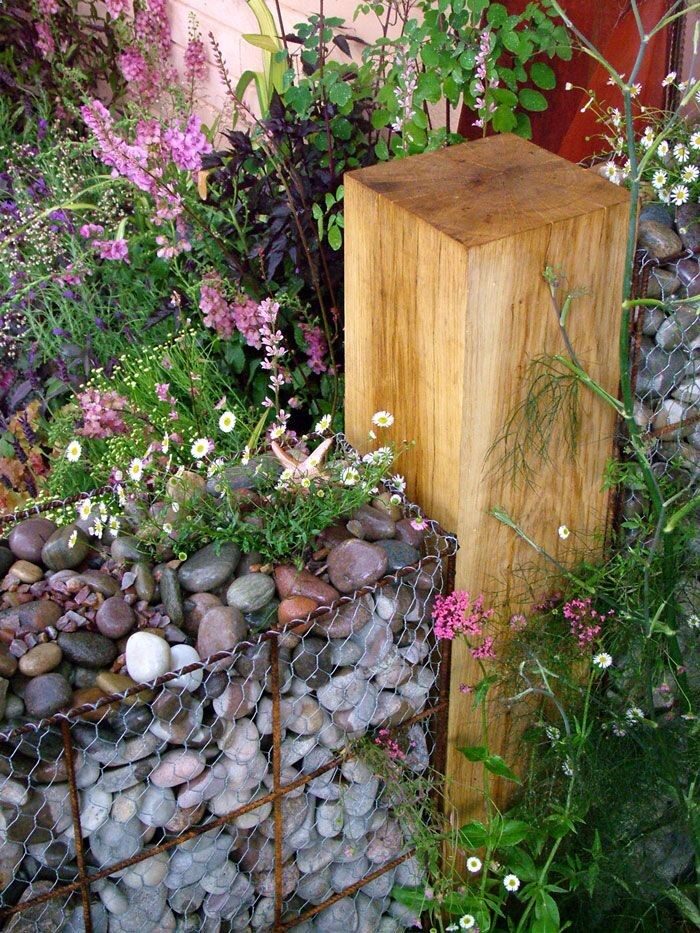 gabion wall for the flower garden – never heard of such a thing! I think I need it