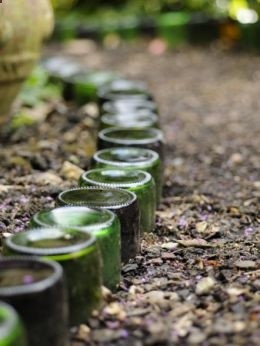 upturned bottles edge garden path..