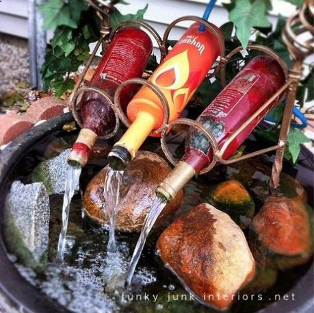 reuse wine bottles for a diy fountain :) but will use mason jars! Would be more awesome if there was a light making the water look like wine……. this is an awesome idea!
