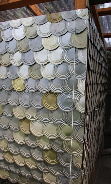 tin can lids as shingles on chicken coop