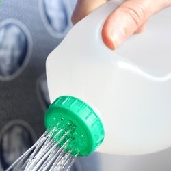 Use a heated needle to make pinprick holes in the cap. Voila – a recycled watering bottle!