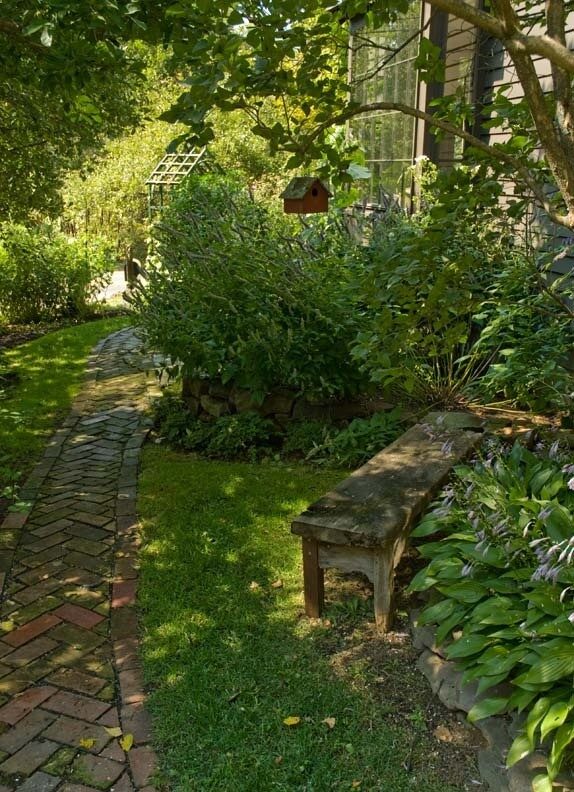 brick walkway ~ old weathered bench