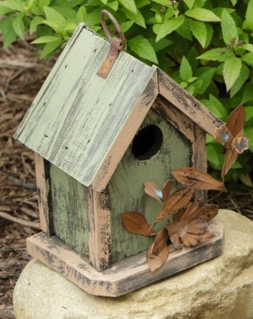Birdhouse with tin flowers