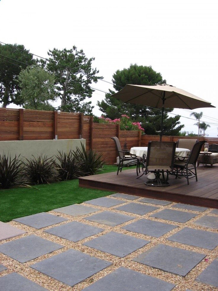 love this look of pavers/gravel – pretty sure dog would quickly scatter gravel into grass, on deck, etc. Also like the plantings.